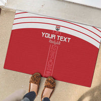Red rubber doormat featuring white stripes and “Your Text” with Egyptian-style icon line art