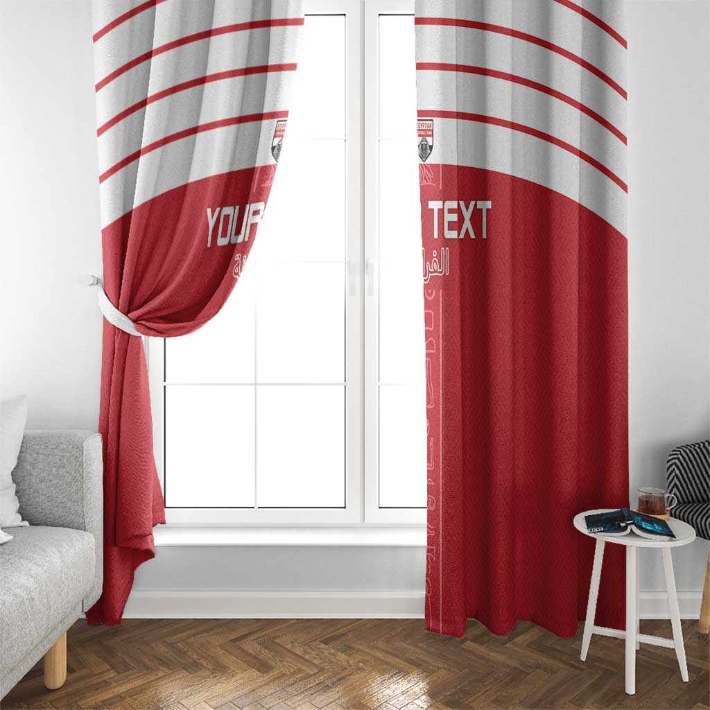 Red window curtain panels with white arched stripes, tied at center over a window.
