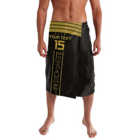 Black patterned lavalava skirt with green waistband and gold player graphic, side view