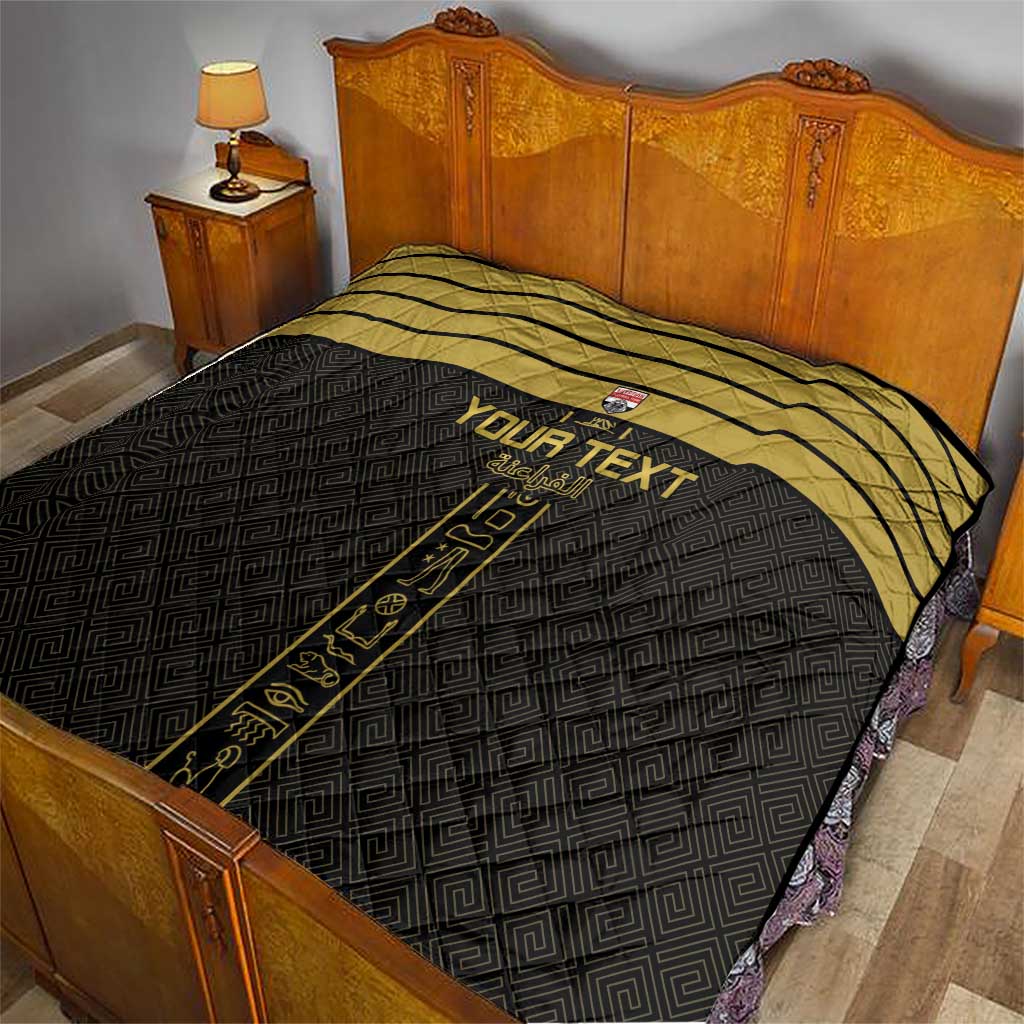 Black and gold custom football quilt laid on a bed with a vertical emblem print