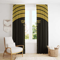 Black and gold curtain panels with vertical gold text stripe, hanging over window