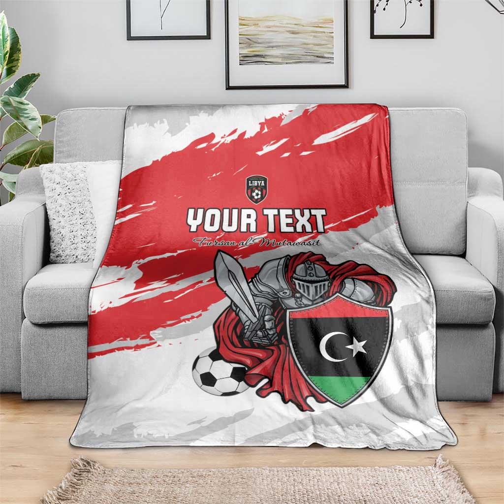 Custom football blanket on sofa with red stripe, shield emblem, and armored soccer player