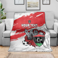 Custom football blanket on sofa with red stripe, shield emblem, and armored soccer player