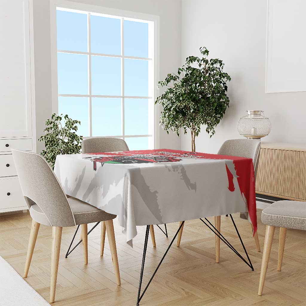 White football tablecloth draped on dining table with red stripe and crest design
