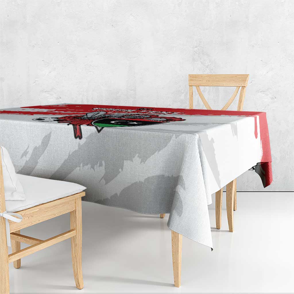 White football tablecloth with red stripe and crest print, hanging over table edge