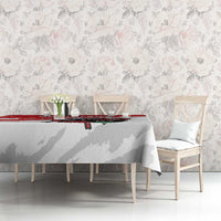 White football tablecloth with red stripe and Libya crest, on dining table against wall