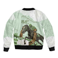 Back of green bomber jacket with white panels, black ribbed hem, horse racing text print