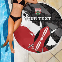 Round fringe beach blanket poolside in black, white, red with Kenya crest and surfboard