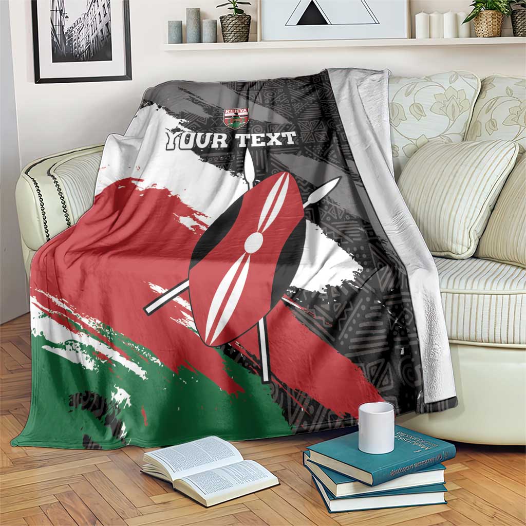 Kenya rugby sevens blanket with black, red, green, and white graphic, umbrella and crest