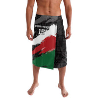 Men's black wrap-style lavalava with geometric panel and red, green accents