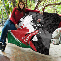Black quilt held outdoors with Kenya flag grunge artwork, surfboard graphic, custom text