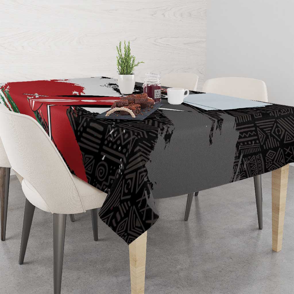 Black tablecloth showing red and green diagonal sections with African pattern