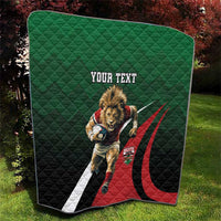 Green quilt with lion rugby graphic, red/black curved stripes, 'YOUR TEXT' and white border
