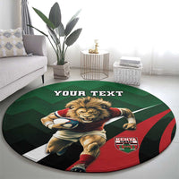Round green rugby rug with lion graphic, red shield badge, and "YOUR TEXT" text