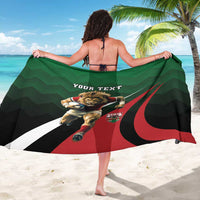 Green custom sarong with lion emblem and red swoosh across hem, 'YOUR TEXT'