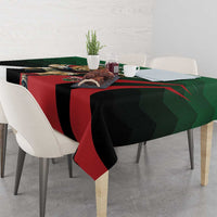 Rectangular green, black, and red tablecloth with bold diagonal rugby pattern