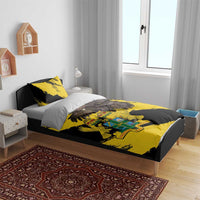 Yellow and black duvet cover with Ghana coat of arms and eagle wing design on bed