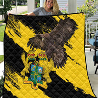 Ghana eagle quilt blanket with black-and-yellow diamond quilting and crest emblem