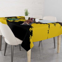 Yellow and black grunge tablecloth with diagonal brush strokes, styled on a dining table.