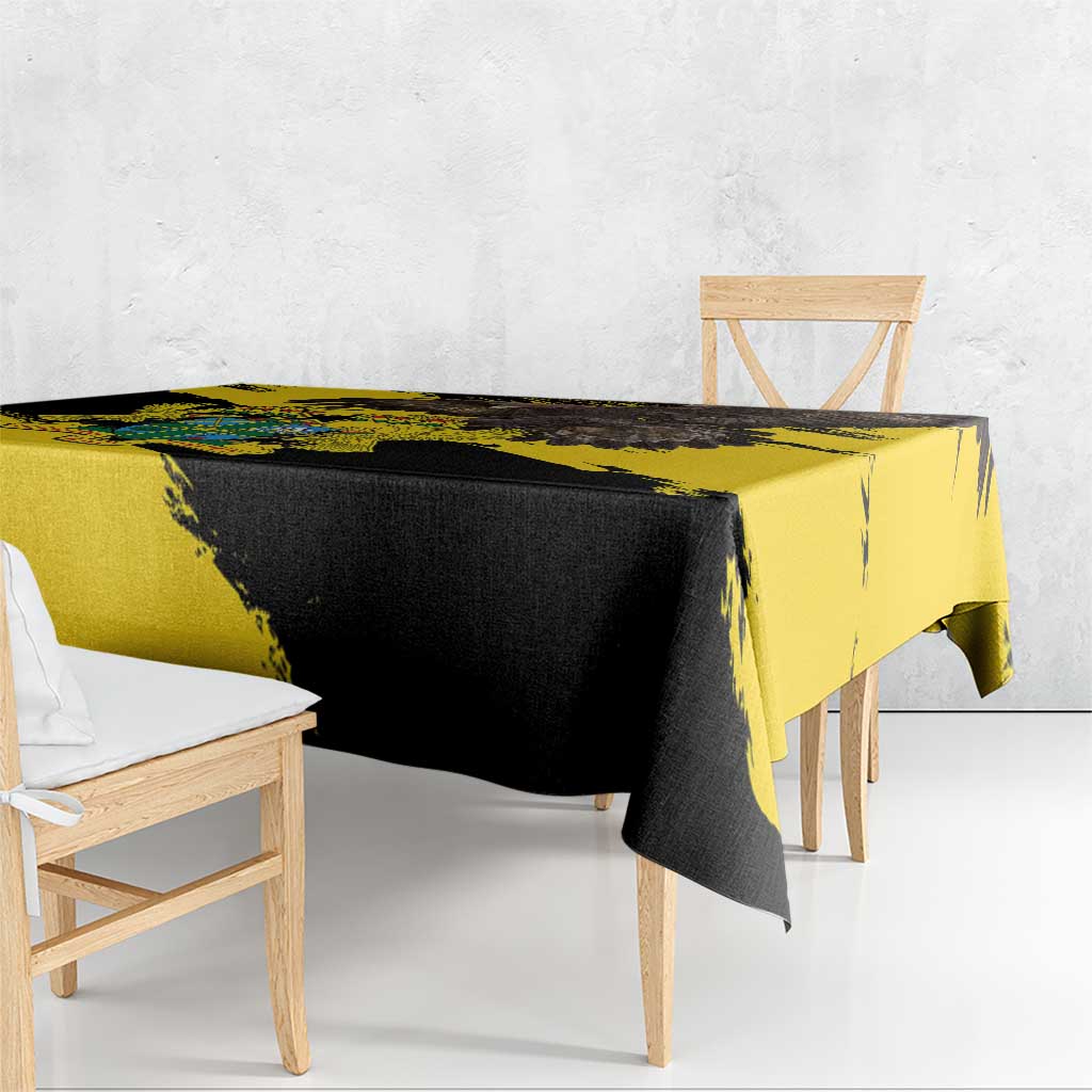Grunge-style tablecloth with yellow and black diagonal design, draped over a table.