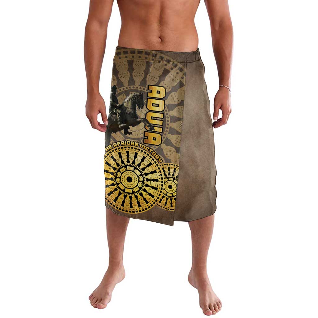 Brown lavalava-style wrap skirt with yellow text and circular emblem graphic on the front