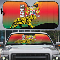 Auto sun shade with Benin coat of arms, leopard print, and flag-color rainbow on windshield