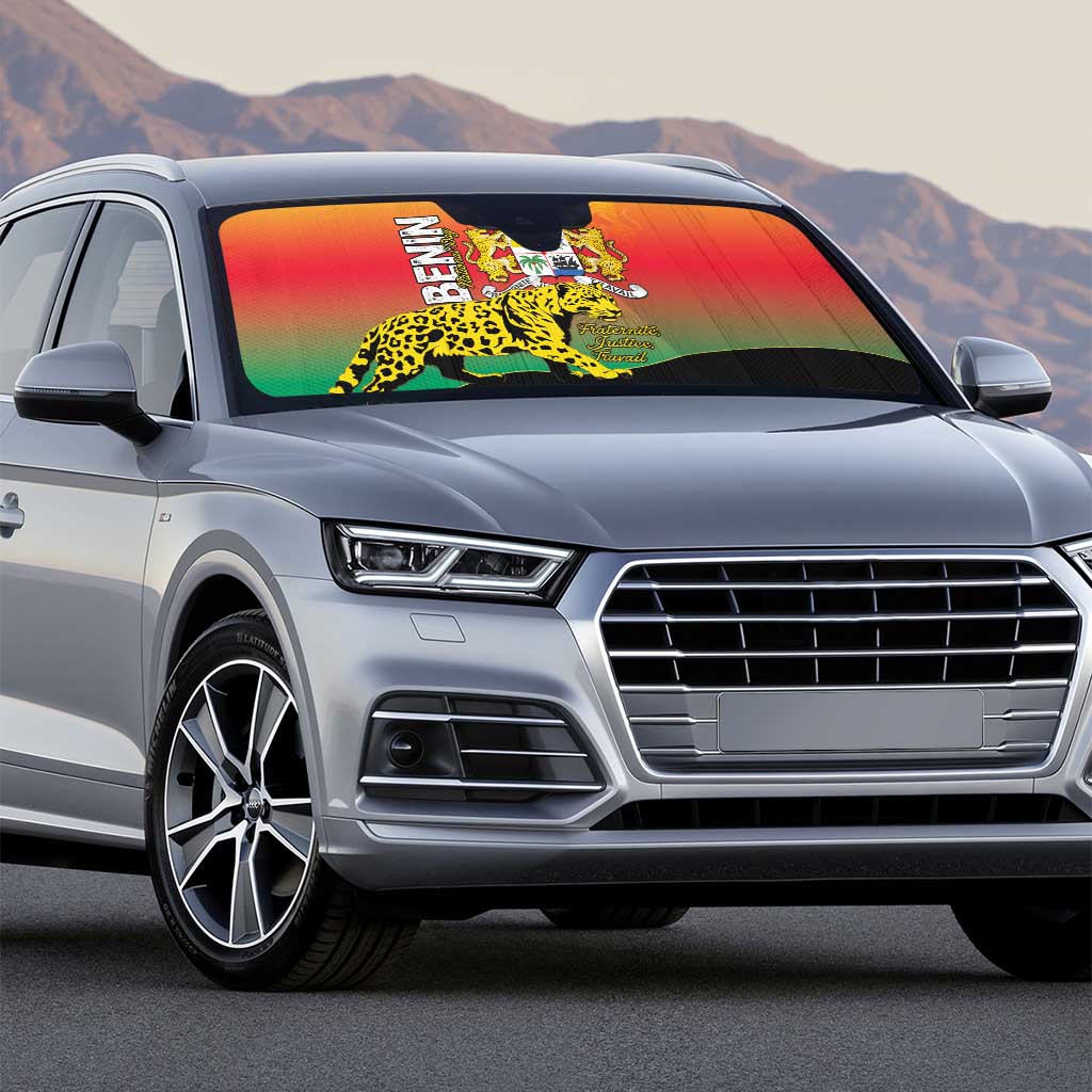 Auto sun shade on silver car with Benin coat of arms and leopard print in rainbow colors