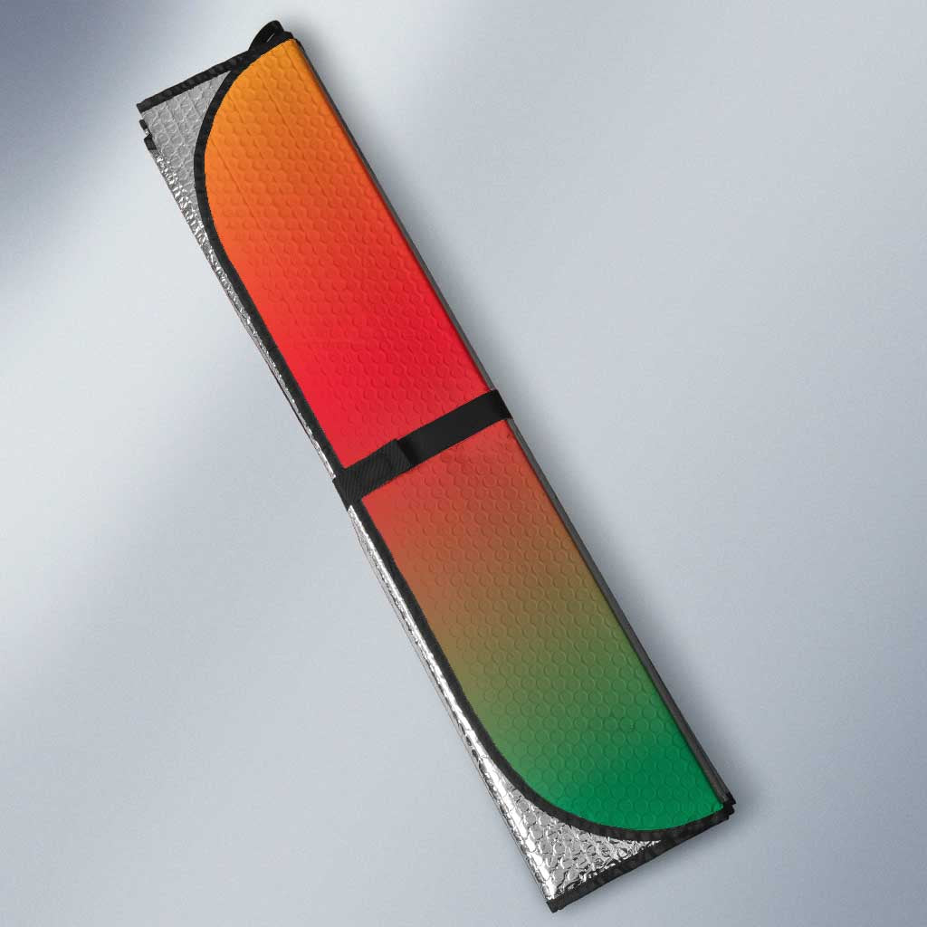 Car sun shade edge with orange, green, and silver pattern, black trim and fold