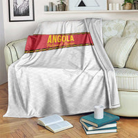 Angola football blanket in white with red center band and star graphic, folded on sofa