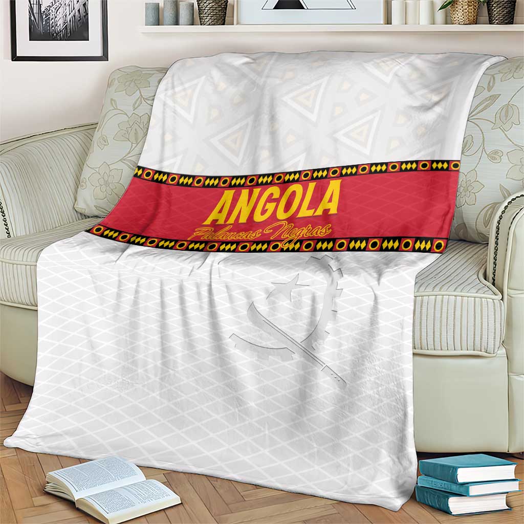 Angola football blanket on armchair, white fabric with red stripe and Angola text