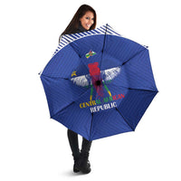 Blue football umbrella held open, Central African Republic crest on canopy