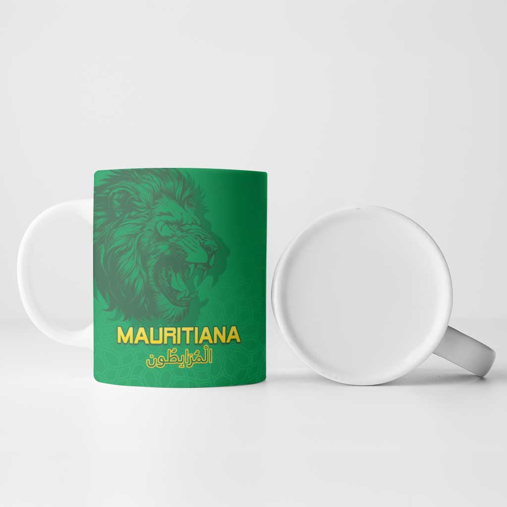 Green ceramic mug front with lion head and gold “MAURITlANA” lettering