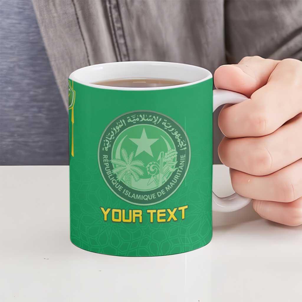 Green ceramic mug held in hand with Islamic circular crest and gold “YOUR TEXT”