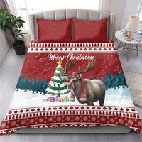 Red Christmas bedding set with two pillows and duvet featuring a standing moose