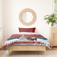 Red Christmas bedding set on wooden bed with duvet and moose holiday motif