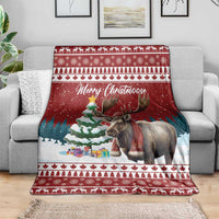 Red Christmas throw blanket with reindeer scene and 'Merry Christmoose' center