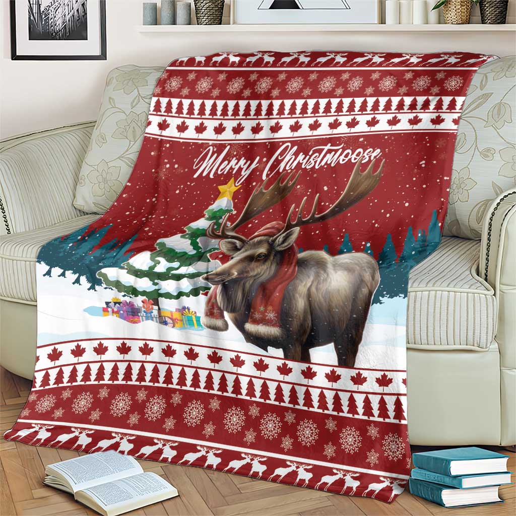 Red Christmas blanket draped on sofa, reindeer graphic and 'Merry Christmoose' script