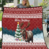 Red Christmas quilt with quilted texture, 'Merry Christmoose' text and central moose