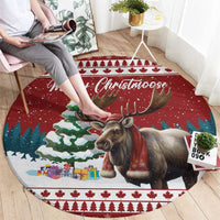 Red round Christmas rug featuring a moose, snowy hills, Merry Christmoose text, and tree border