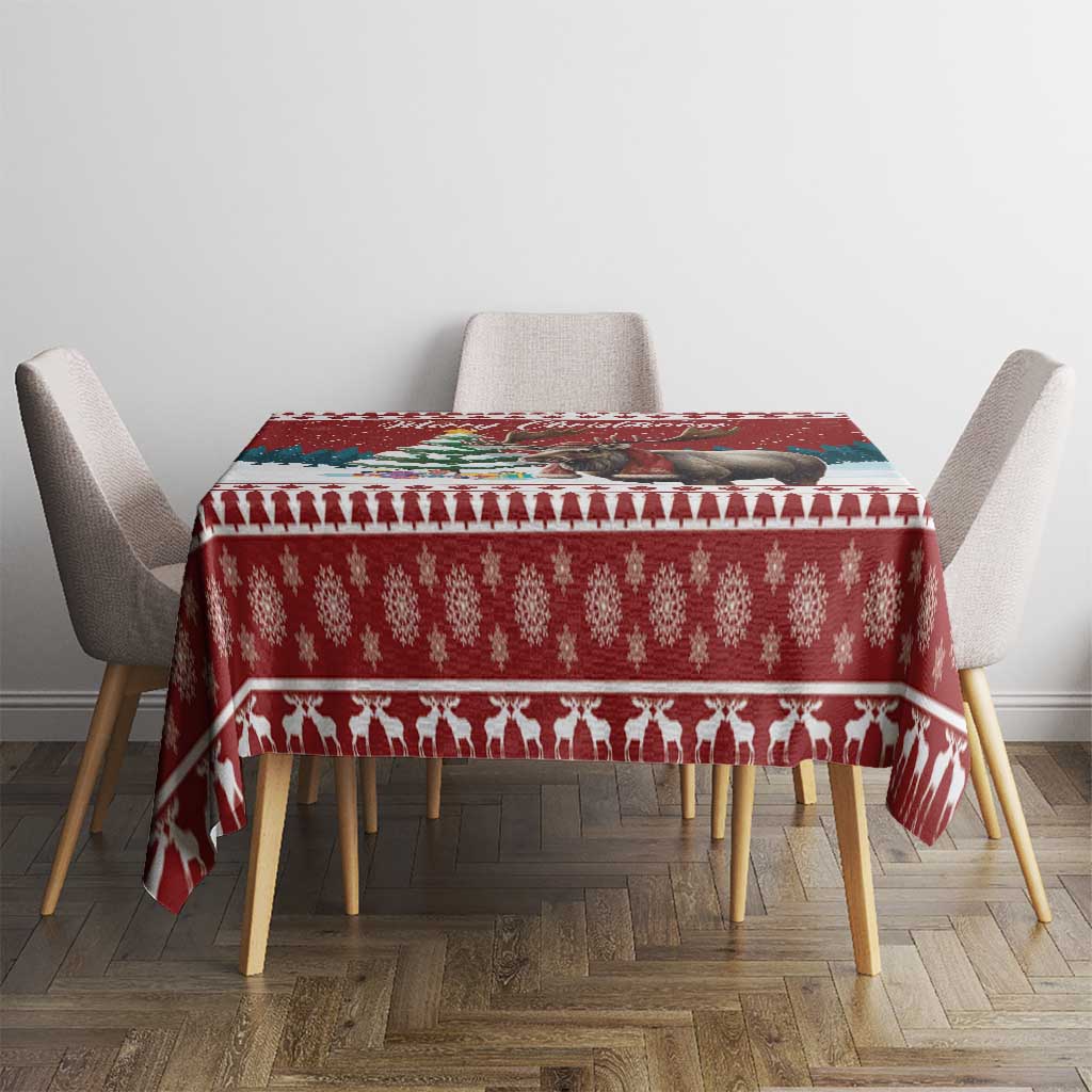 Red Christmas tablecloth on dining table with repeating icons and patterned trim