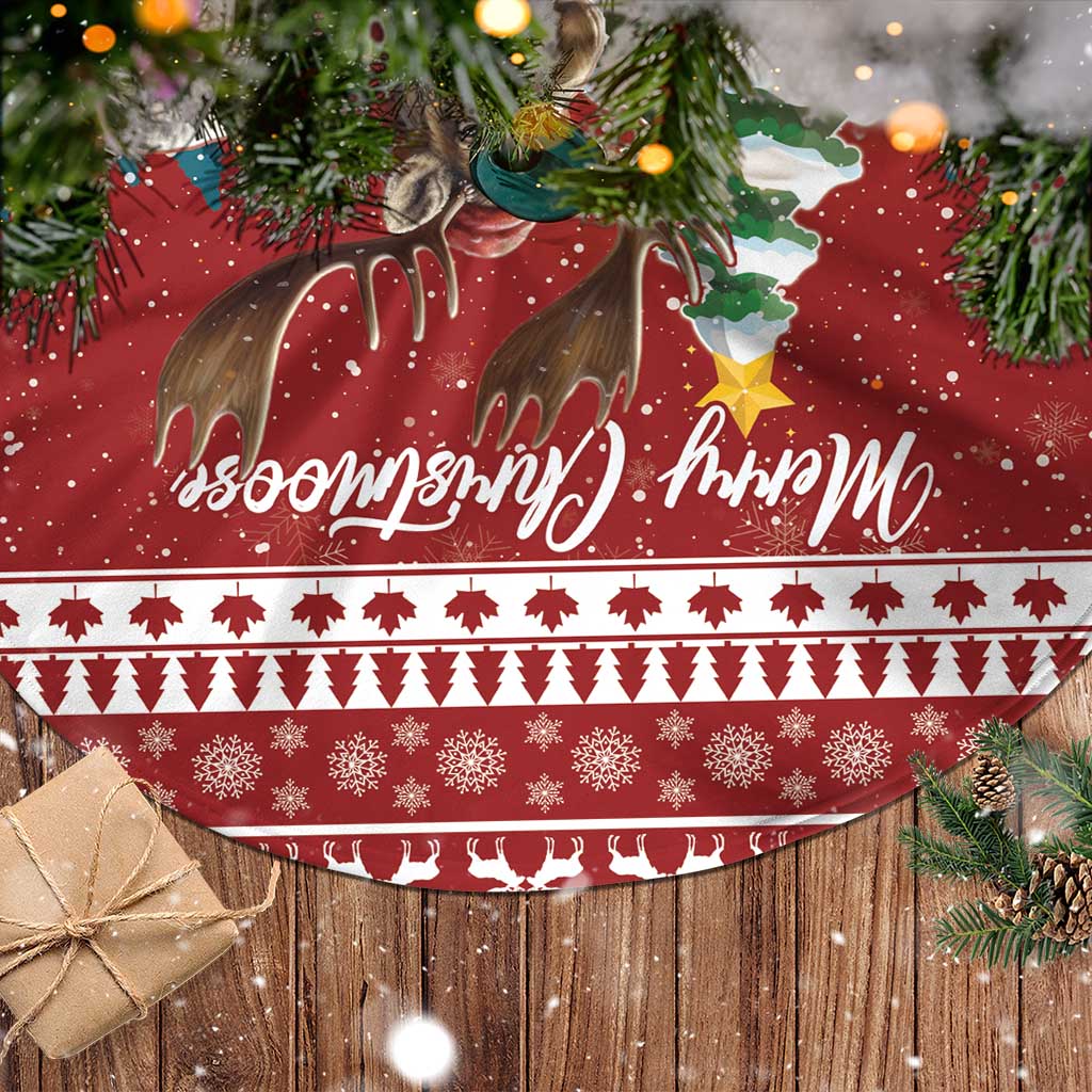 Red tree skirt with deer, snowflake patterns, festive lettering, and white trim