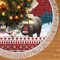 Red tree skirt with deer scene, blue pine band, and white fringed border