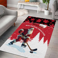 Red holiday area rug with Santa hockey player, black leaf pattern, and 'BEST PUCKING XMAS EVER'