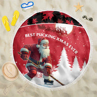 Round Christmas beach blanket with red Santa hockey graphic and white fringe border