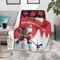 Red Christmas blanket with Santa hockey player design and pine trees