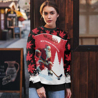 Red and black ugly Christmas sweater with Santa hockey player front graphic and snow trees