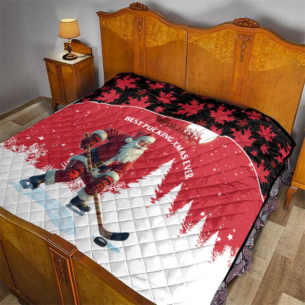 Red and white quilt with Santa hockey player, black maple-leaf top border pattern.