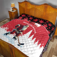 Red and white quilt with Santa hockey player, black maple-leaf top border pattern.