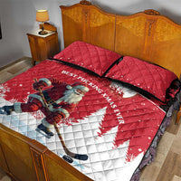 Red quilt bed set with Santa hockey player and white diagonal maple leaf snowflake design