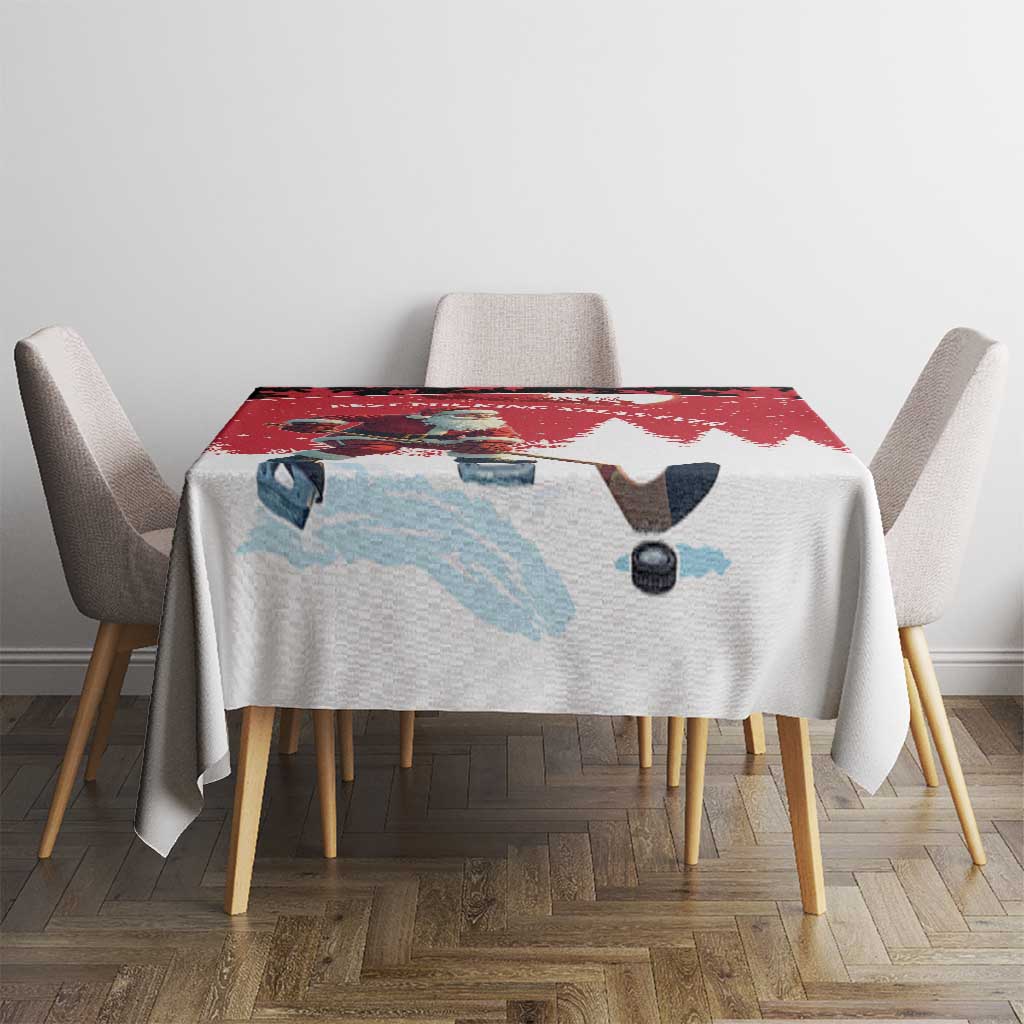 Red and white tablecloth on dining table with hockey player graphic and winter snowflakes